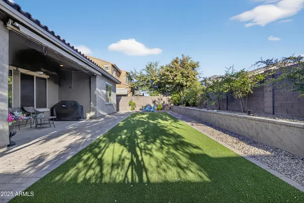 a swimming pool with outdoor seating and yard
