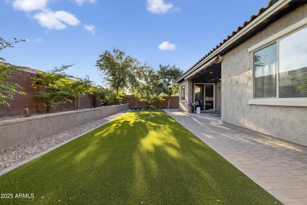 a swimming pool with outdoor seating and yard