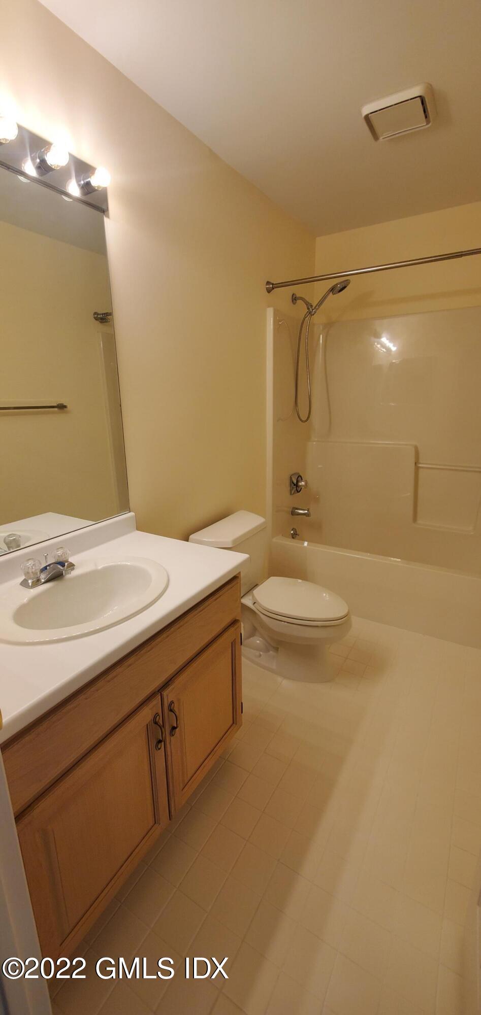 351 Pemberwick Road, Unit 821 Greenwich, CT 06831 - Photo 11 of 16 a bathroom with a sink a toilet and shower