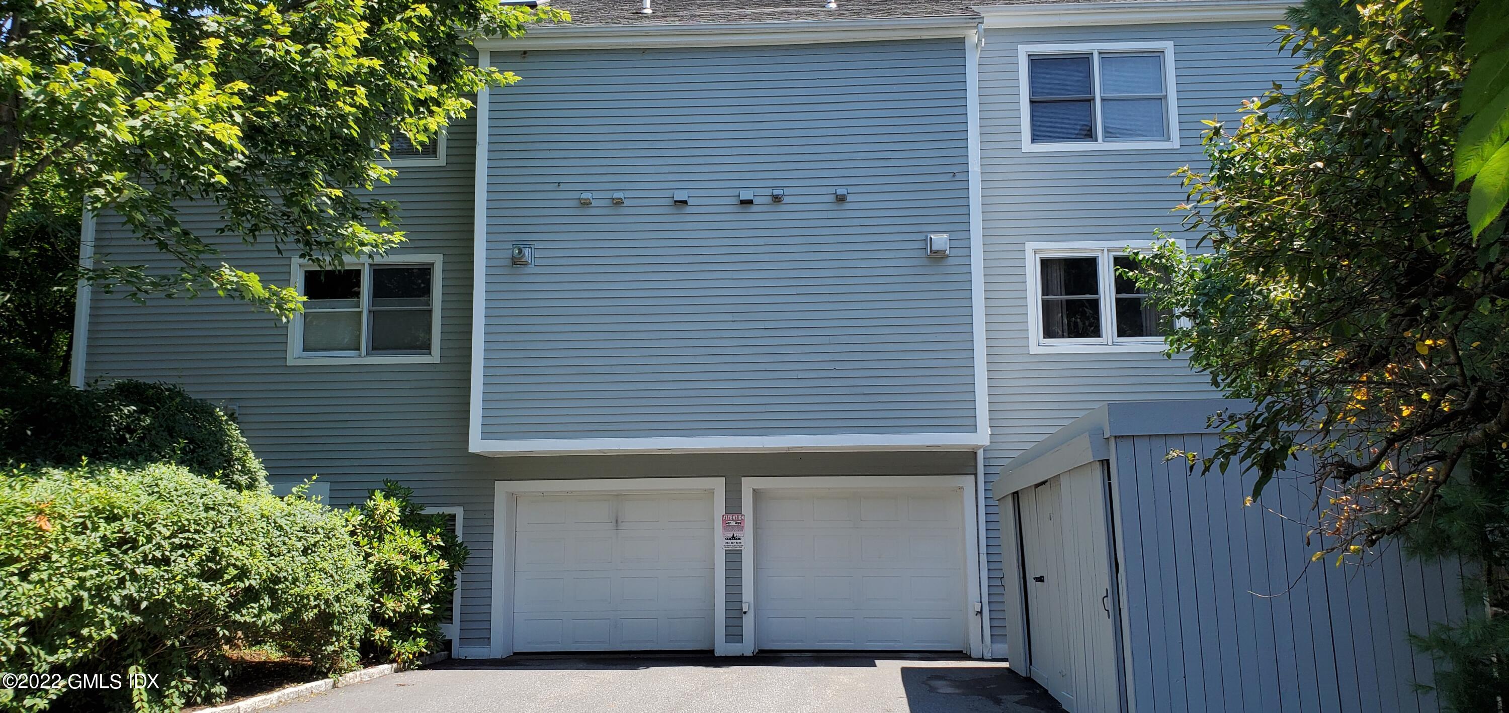 351 Pemberwick Road, Unit 821 Greenwich, CT 06831 - Photo 16 of 16 a view of a house with a garage