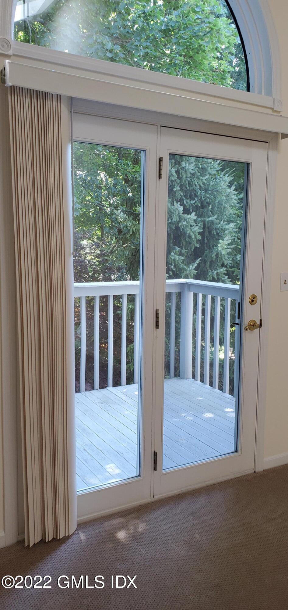 351 Pemberwick Road, Unit 821 Greenwich, CT 06831 - Photo 5 of 16 a view of porch with a small yard
