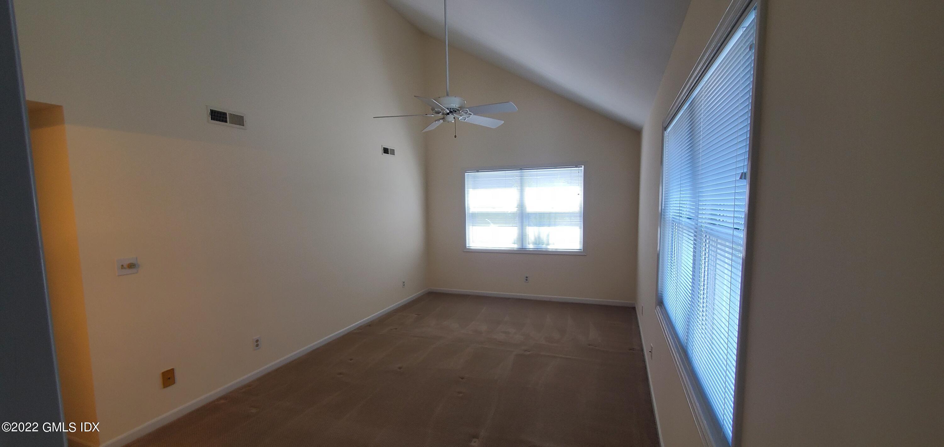 351 Pemberwick Road, Unit 821 Greenwich, CT 06831 - Photo 7 of 16 a view of an empty room with a window