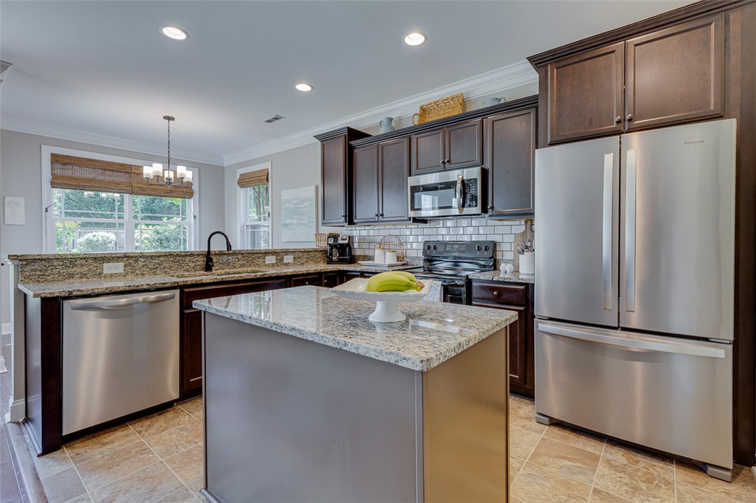 203 Streams Way Anderson, SC 29625 - Photo 21 of 47 This kitchen boasts an island, granite counters, and stainless steel appliances.