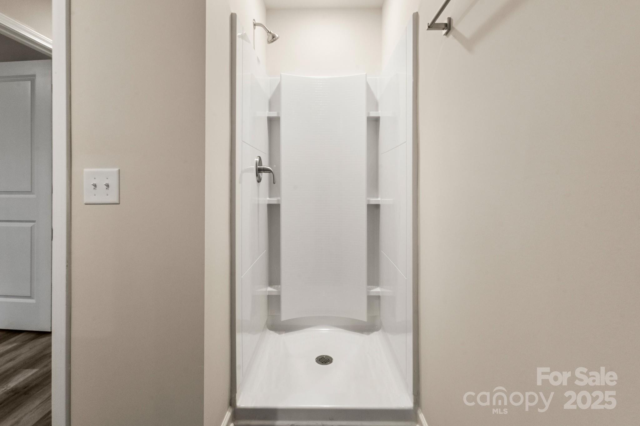 990 Shearers Road Mooresville, NC 28115 - Photo 19 of 46 a bathroom with a glass shower door