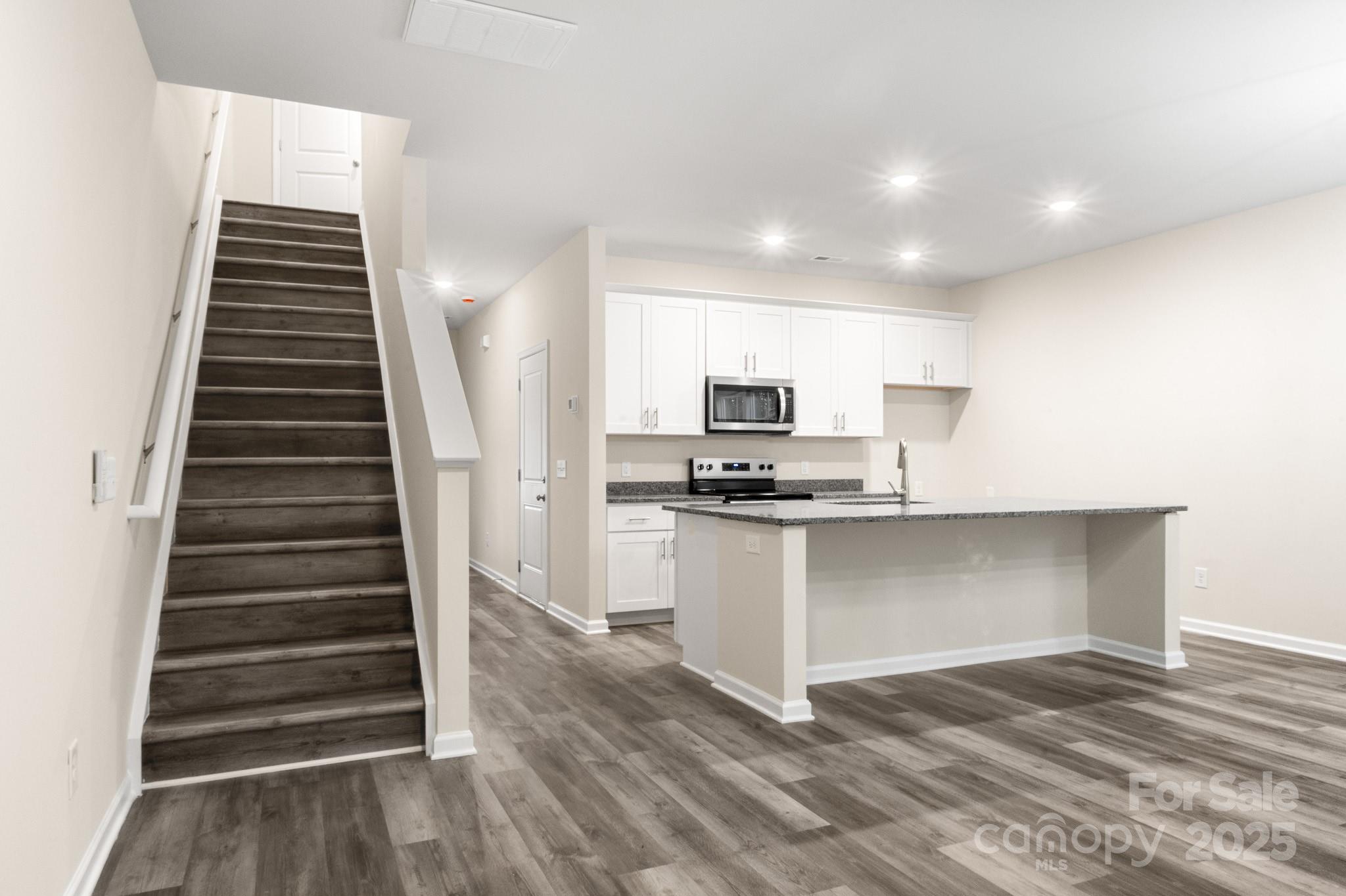 990 Shearers Road Mooresville, NC 28115 - Photo 30 of 46 a view of kitchen with sink microwave and stove