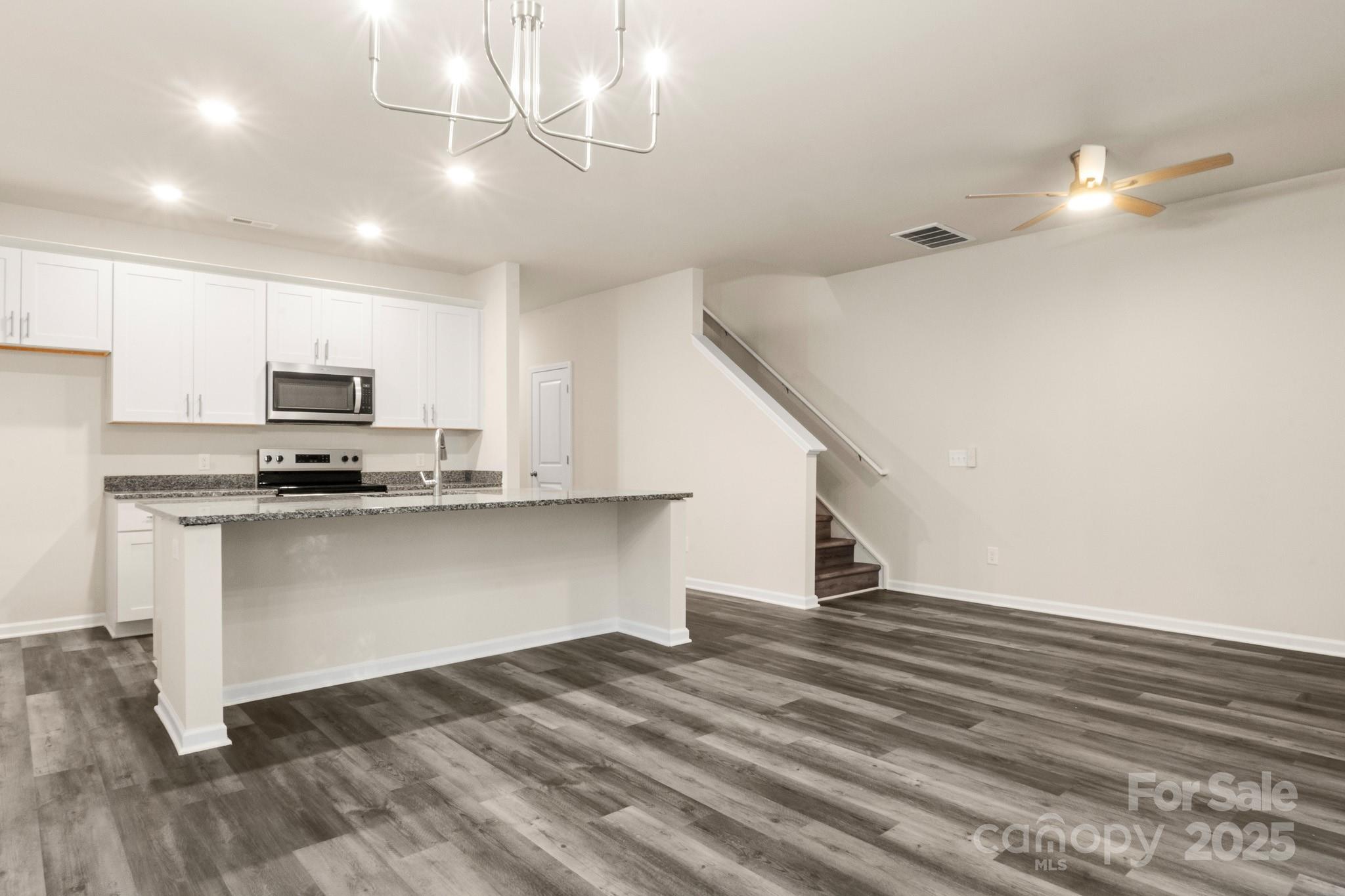 990 Shearers Road Mooresville, NC 28115 - Photo 8 of 46 a view of kitchen with wooden floor and electronic appliances