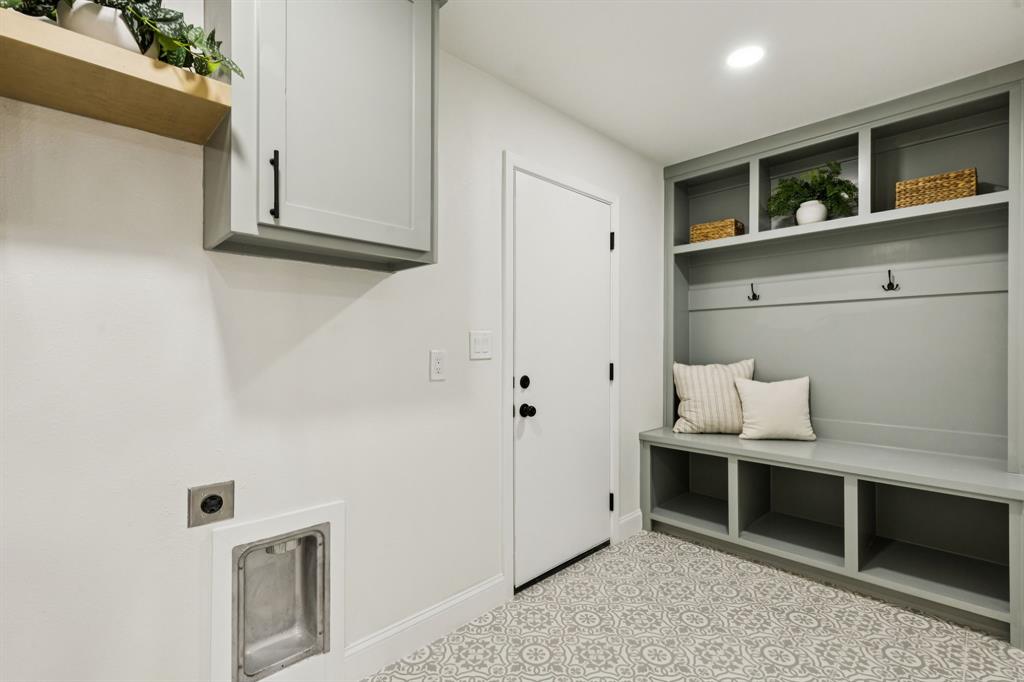 311 High Brook Drive Richardson, TX 75080 - Photo 14 of 26 Laundry area featuring light flooring, electric dryer hookup, cabinet space, and recessed lighting