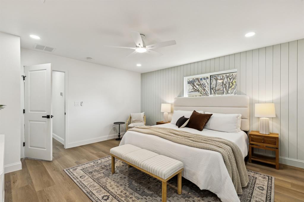 311 High Brook Drive Richardson, TX 75080 - Photo 16 of 26 Bedroom featuring recessed lighting, ceiling fan, light wood-type flooring, and an accent wall