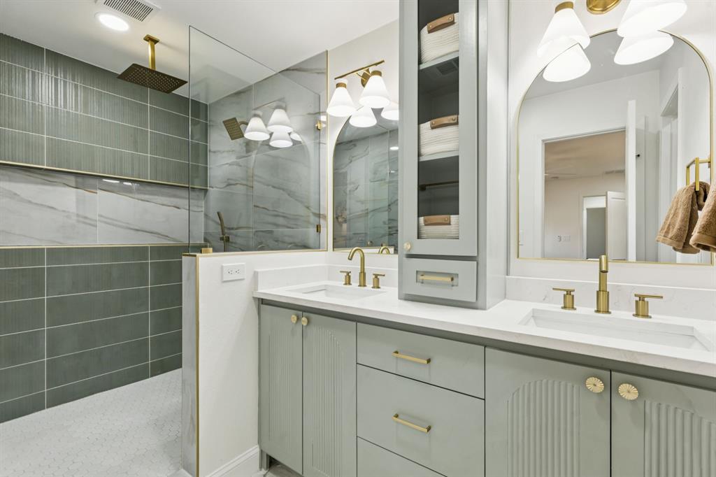 311 High Brook Drive Richardson, TX 75080 - Photo 18 of 26 Bathroom featuring double vanity and walk in shower