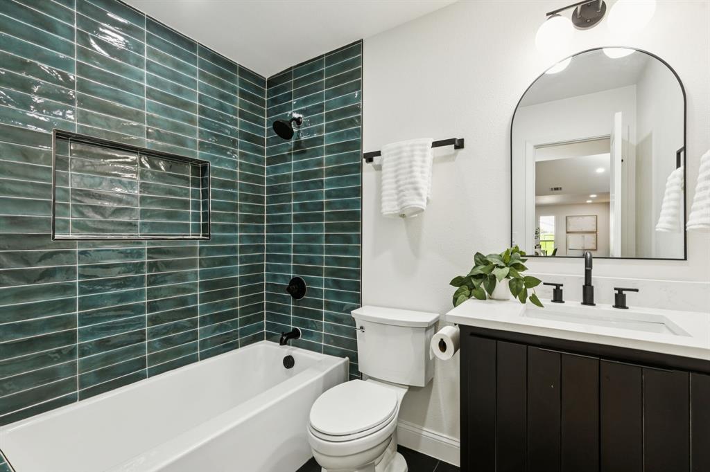 311 High Brook Drive Richardson, TX 75080 - Photo 23 of 26 Full bath featuring vanity and bathing tub / shower combination