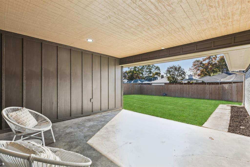 311 High Brook Drive Richardson, TX 75080 - Photo 25 of 26 Fenced backyard featuring a patio area