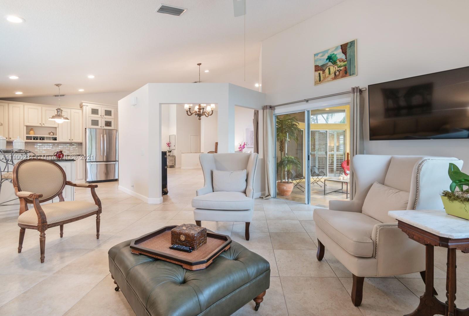 207 Cameron Court Weston, FL 33326 - Photo 14 of 35 a living room with furniture and a flat screen tv