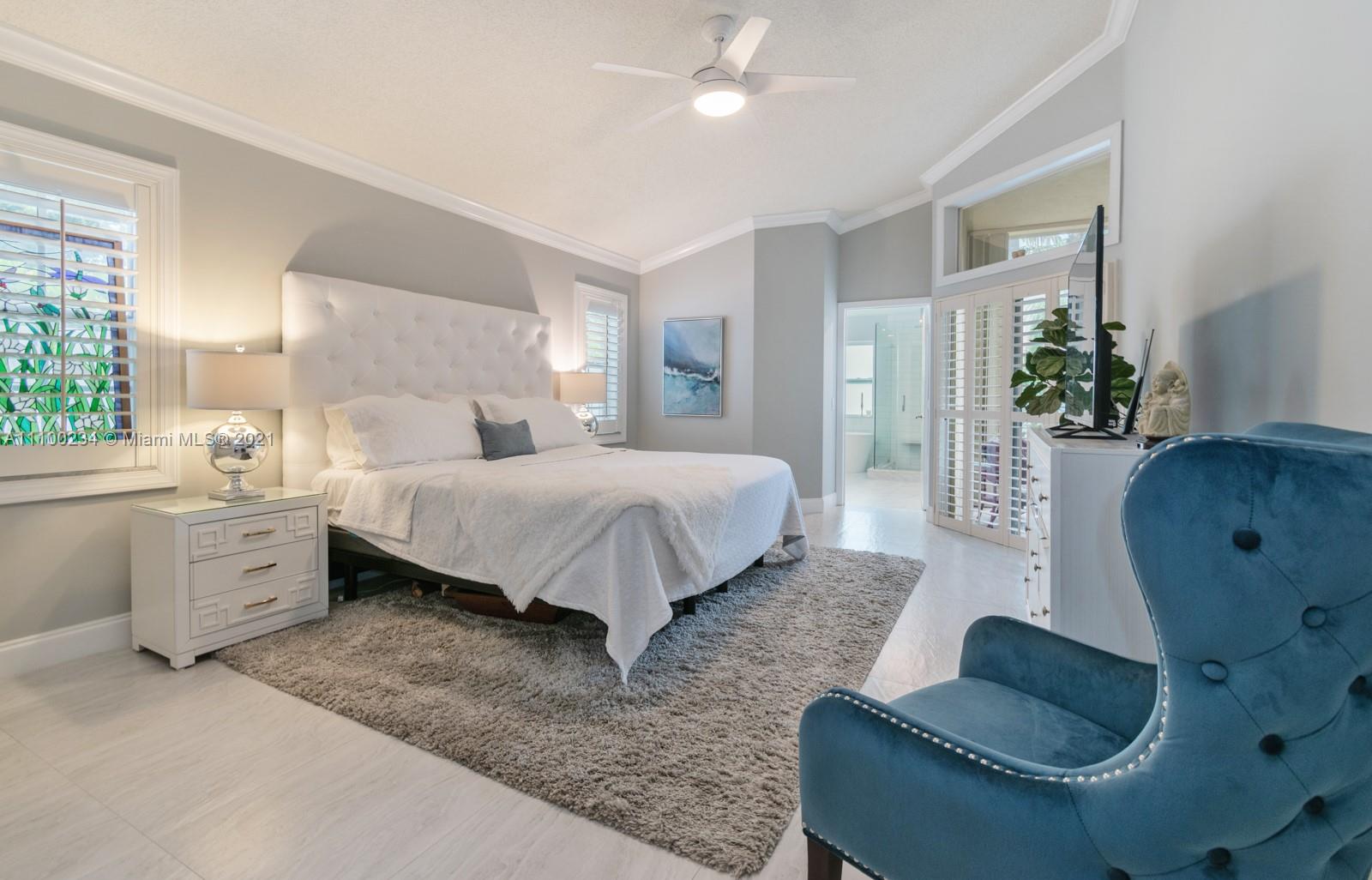 207 Cameron Court Weston, FL 33326 - Photo 15 of 35 a bedroom with a bed couch and window