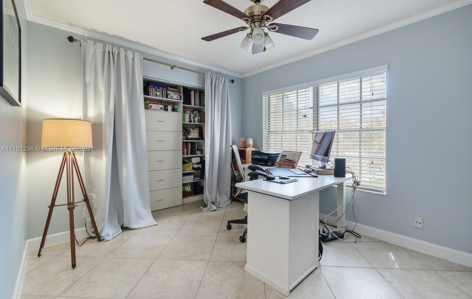 207 Cameron Court Weston, FL 33326 - Photo 22 of 35 a view of a workspace with furniture and a window