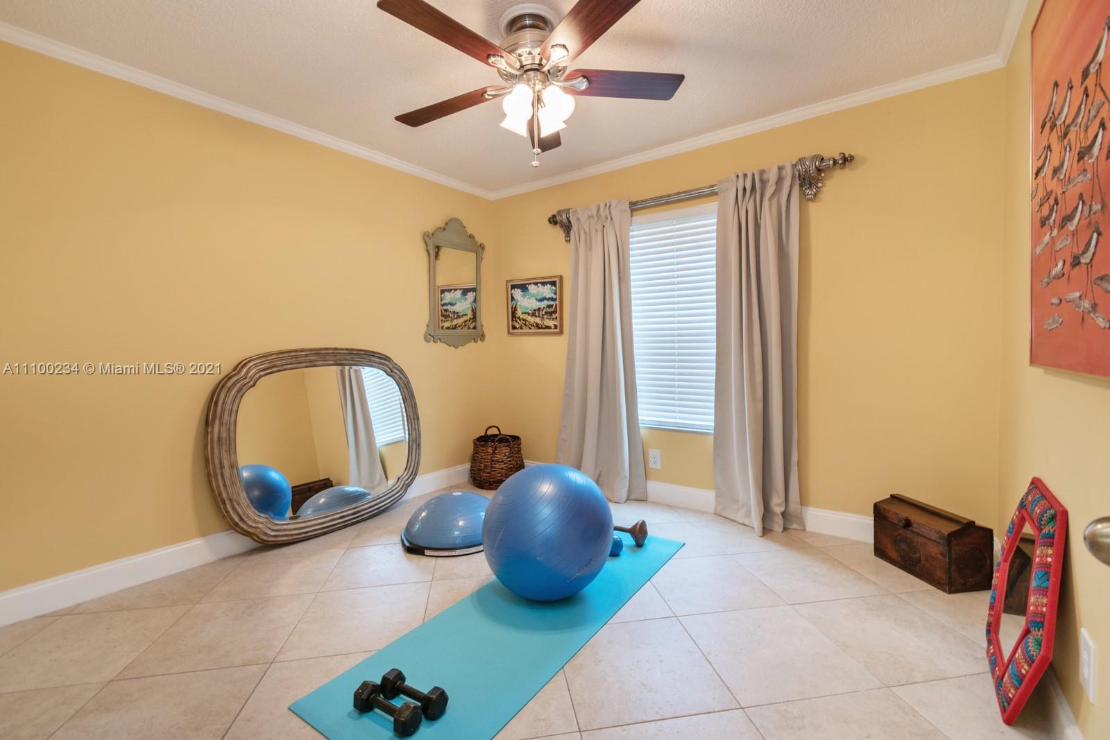 207 Cameron Court Weston, FL 33326 - Photo 25 of 35 a bed room with a bed and a chandelier