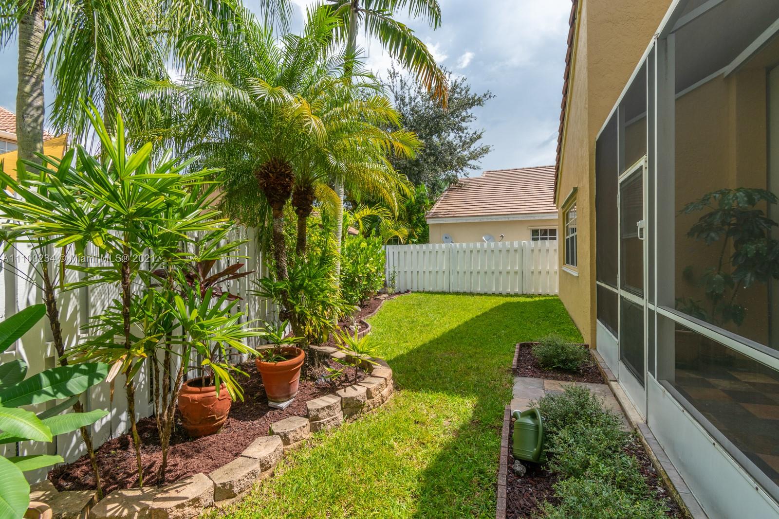 207 Cameron Court Weston, FL 33326 - Photo 34 of 35 a view of a back yard of the house