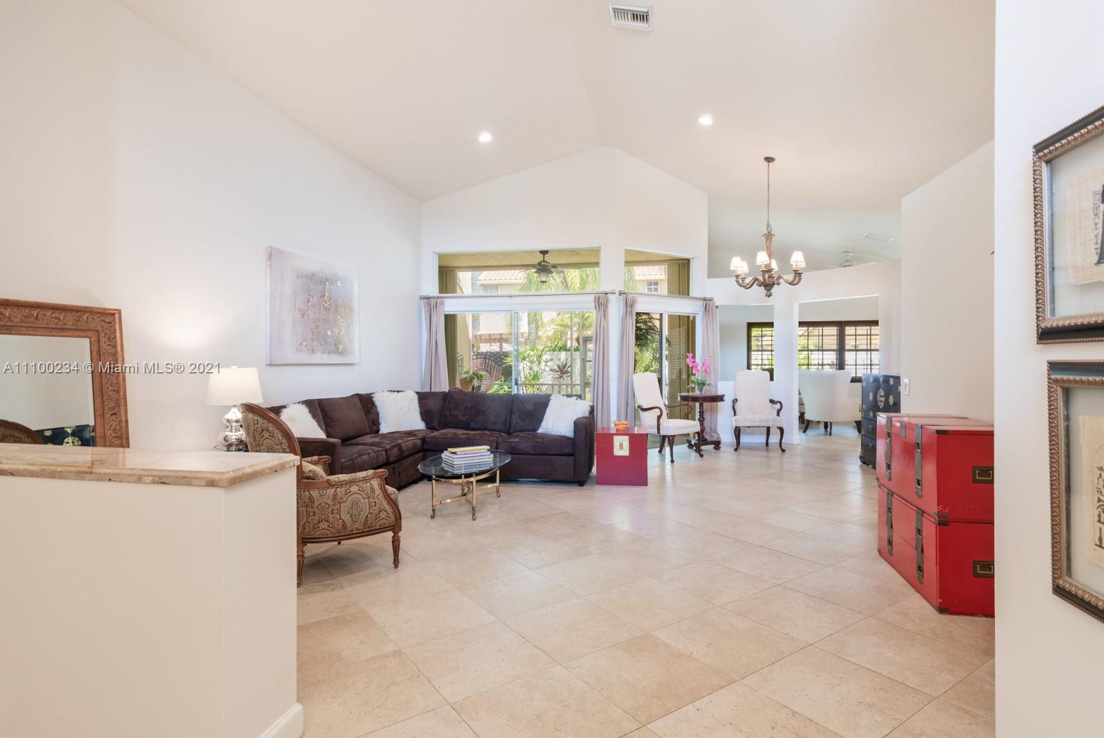 207 Cameron Court Weston, FL 33326 - Photo 6 of 35 a living room with furniture and a large window