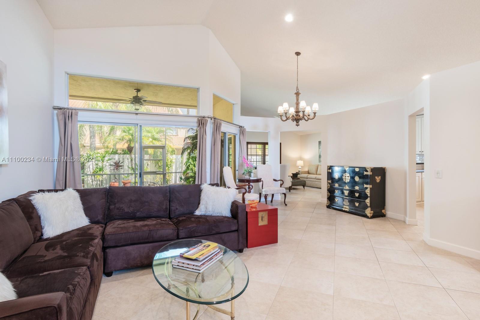207 Cameron Court Weston, FL 33326 - Photo 7 of 35 a living room with furniture and a large window