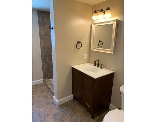152 Haynes Road Sudbury, MA 01776 - Photo 13 of 25 a bathroom with a sink vanity and a mirror