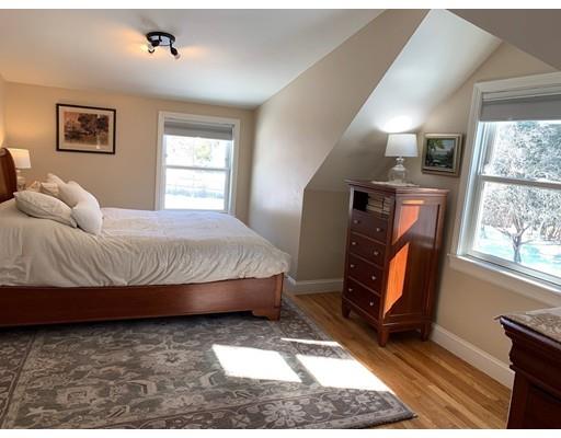 152 Haynes Road Sudbury, MA 01776 - Photo 14 of 25 a bedroom with a bed and wooden floor