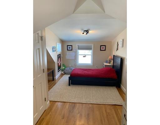 152 Haynes Road Sudbury, MA 01776 - Photo 16 of 25 a bedroom with a bed and a potted plant