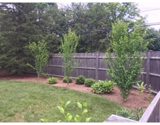152 Haynes Road Sudbury, MA 01776 - Photo 23 of 25 a backyard of a house with lots of green space