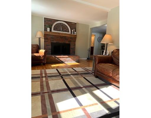 152 Haynes Road Sudbury, MA 01776 - Photo 3 of 25 a living room with a couch and a fireplace