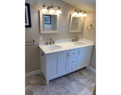 152 Haynes Road Sudbury, MA 01776 - Photo 10 of 25 a bathroom with a double vanity sink and mirror
