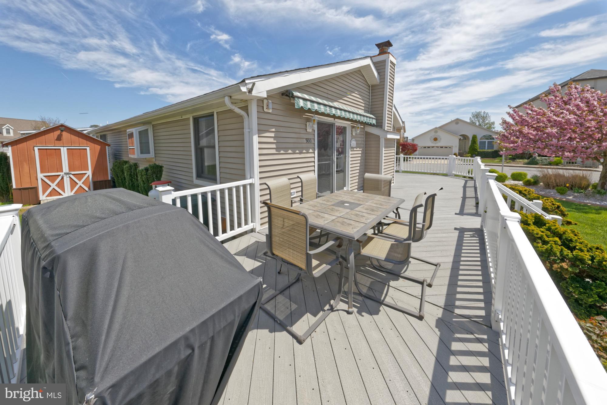 500 South Surf Road Ocean City, MD 21842 - Photo 20 of 27 Dining area of deck with electric awning