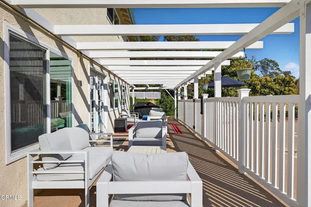 a view of balcony with furniture