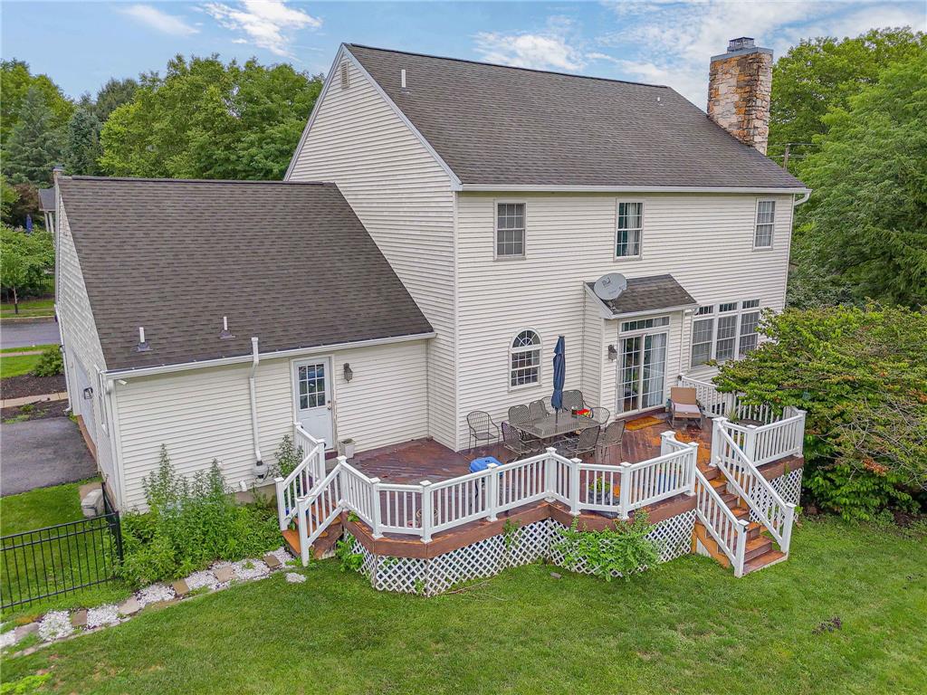 102 Sutton Road Easton, PA 18045 - Photo 75 of 83 A spacious elevated deck overlooks the lush green yard and surrounding mature trees.