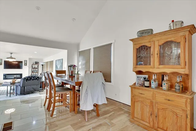 a dining room with furniture and wooden floor
