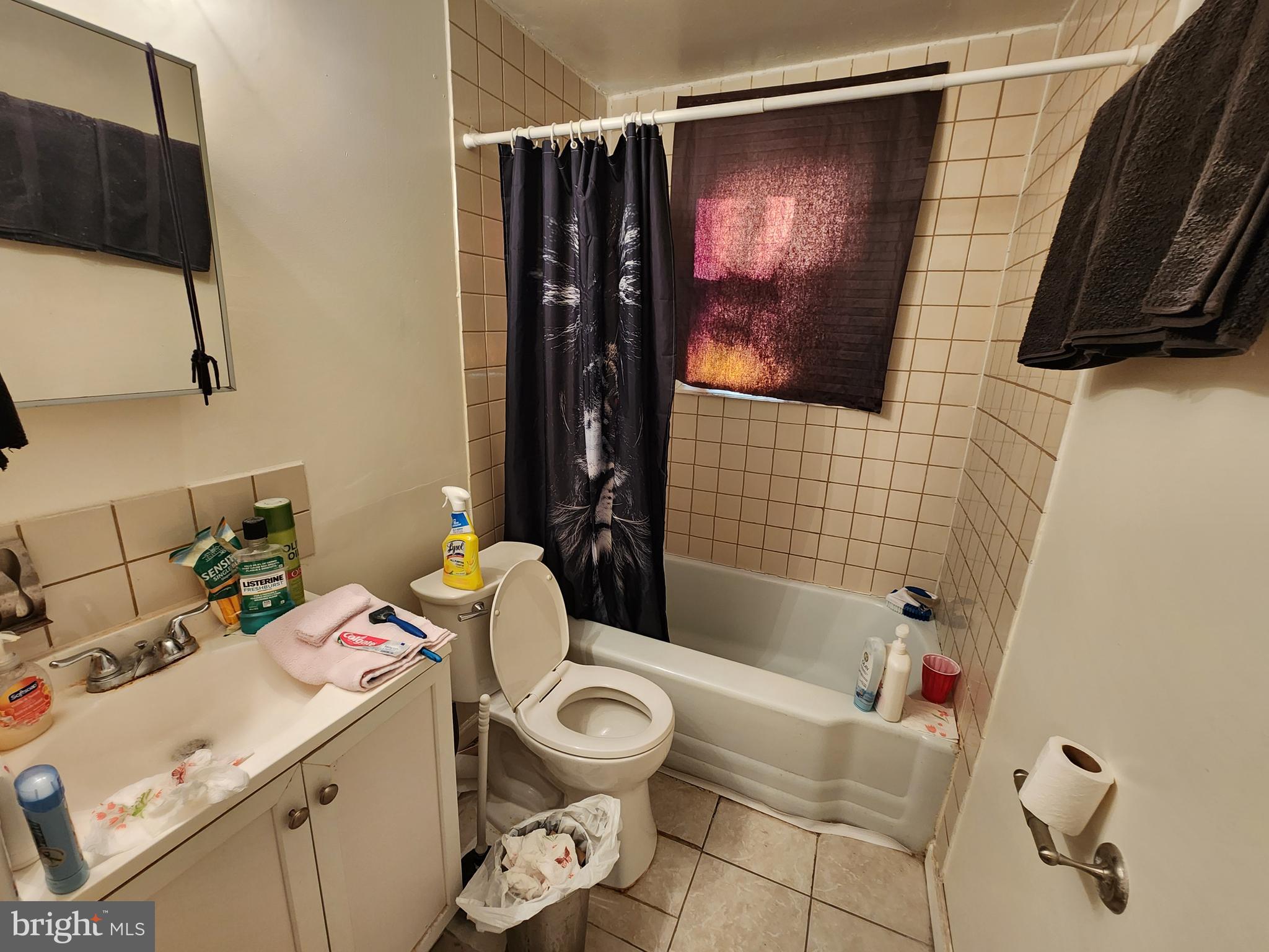 2723 Round Road Baltimore, MD 21225 - Photo 11 of 18 a bathroom with a sink toilet and shower