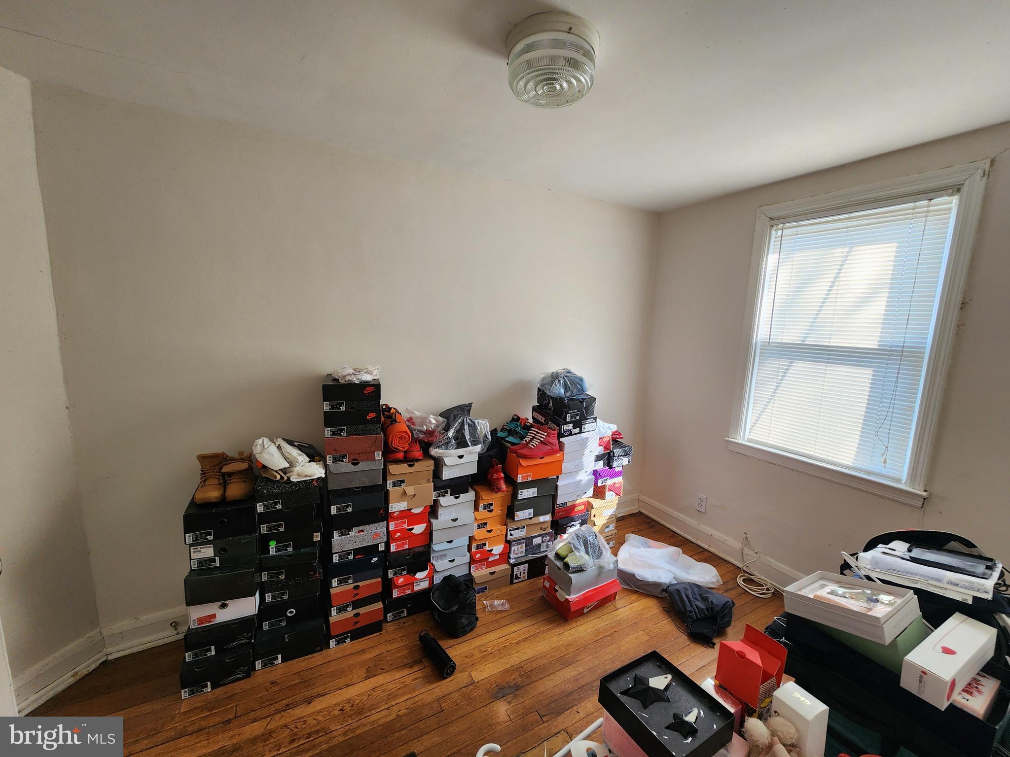 2723 Round Road Baltimore, MD 21225 - Photo 14 of 18 a room with furniture a rug and a window
