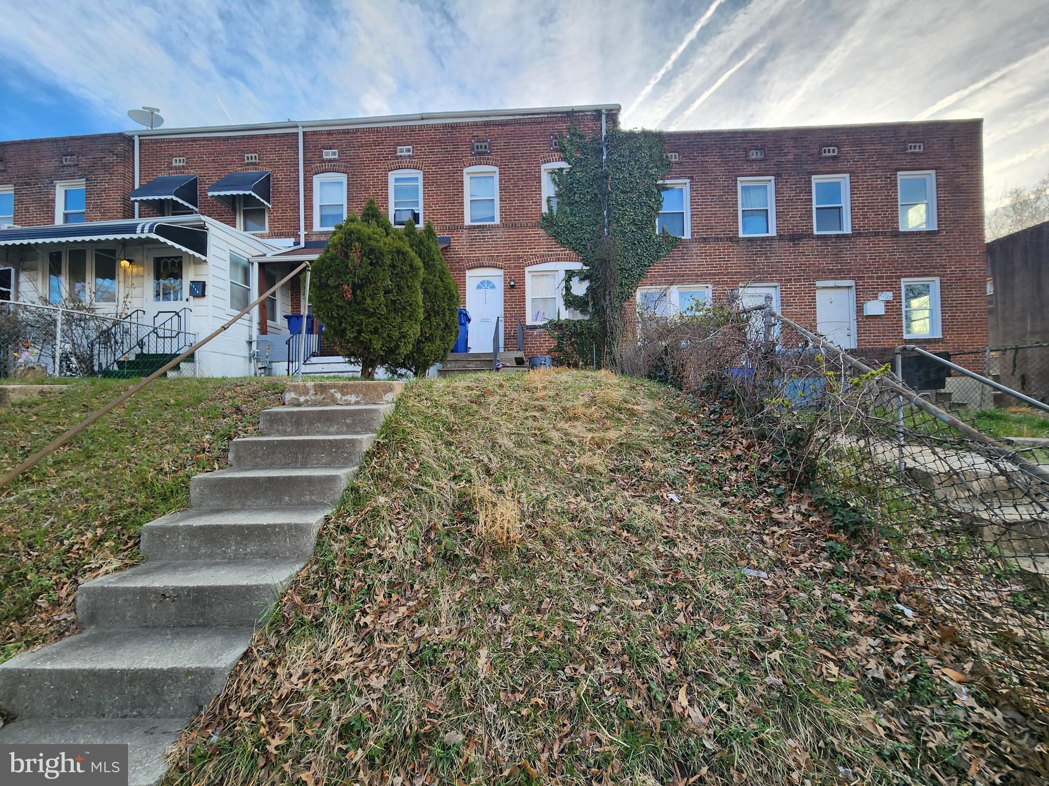 2723 Round Road Baltimore, MD 21225 - Photo 2 of 18 a front view of a house with a yard