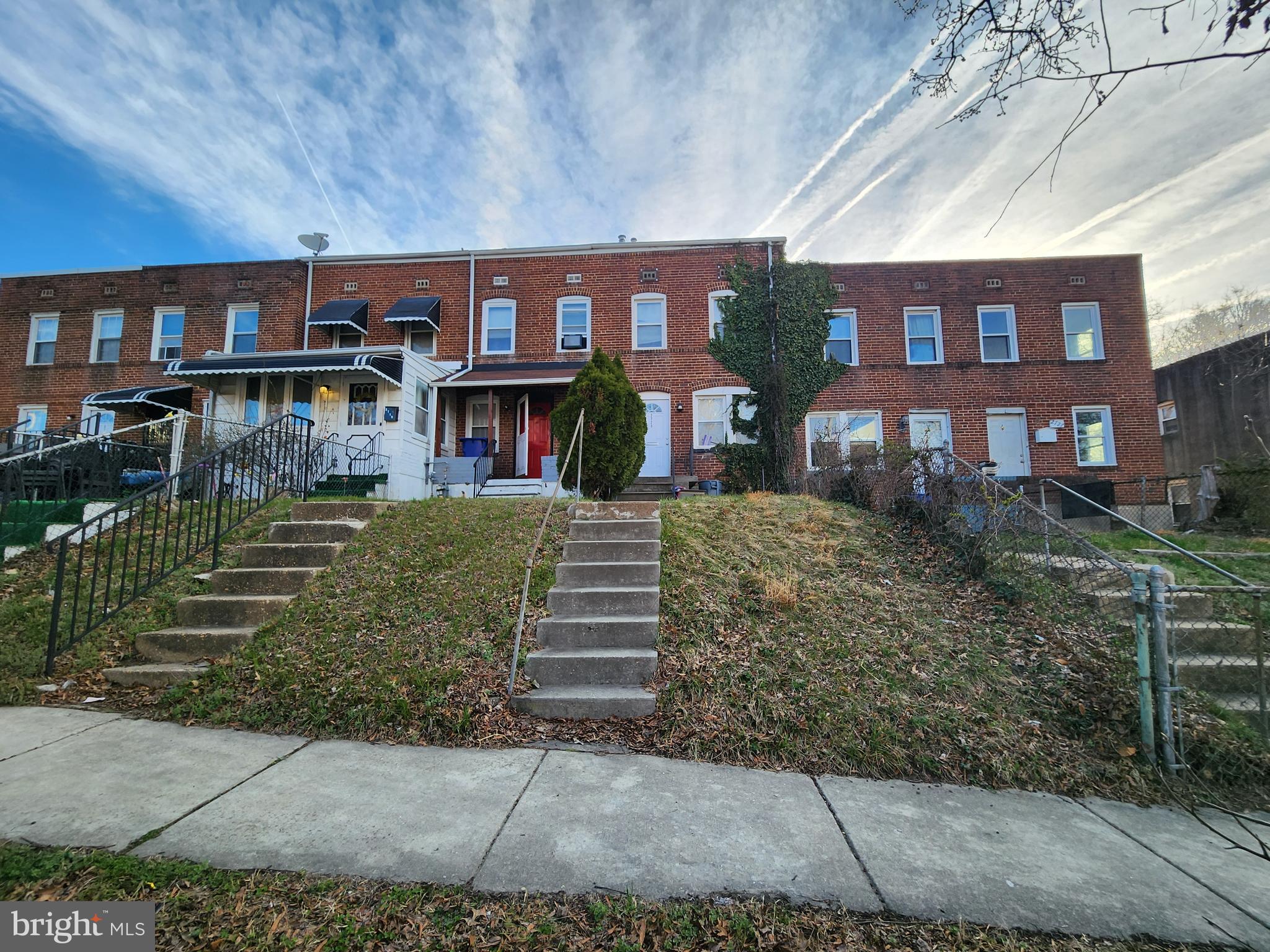 2723 Round Road Baltimore, MD 21225 - Photo 3 of 18 front view of a house with a yard