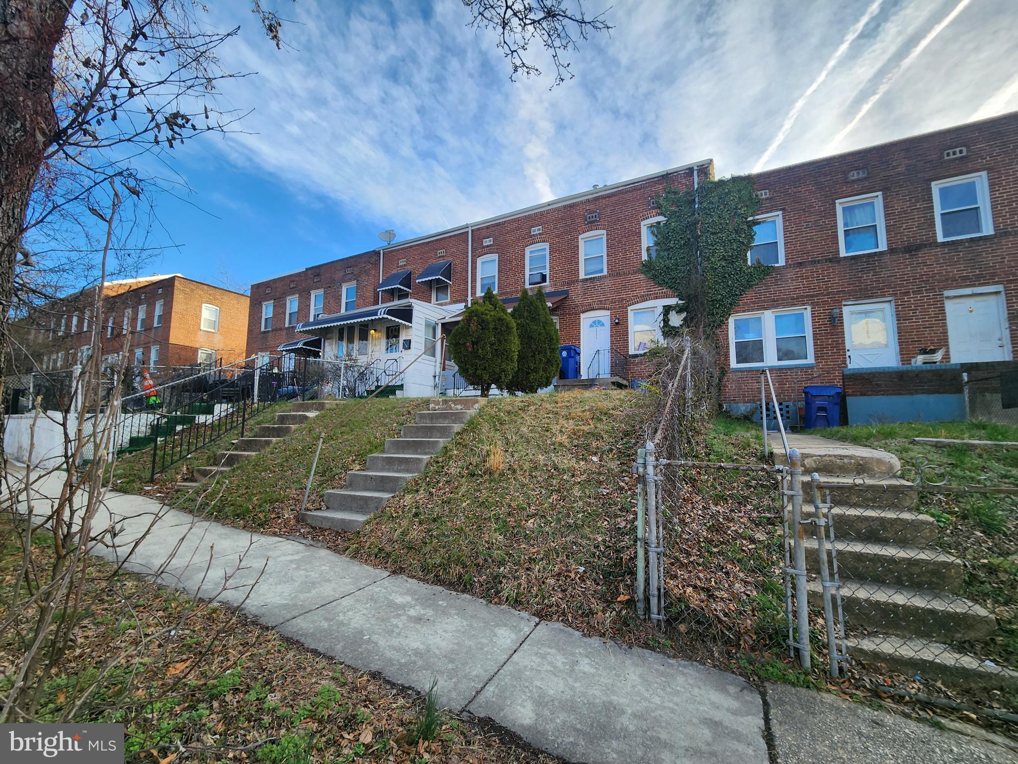 2723 Round Road Baltimore, MD 21225 - Photo 5 of 18 front view of a house with a yard