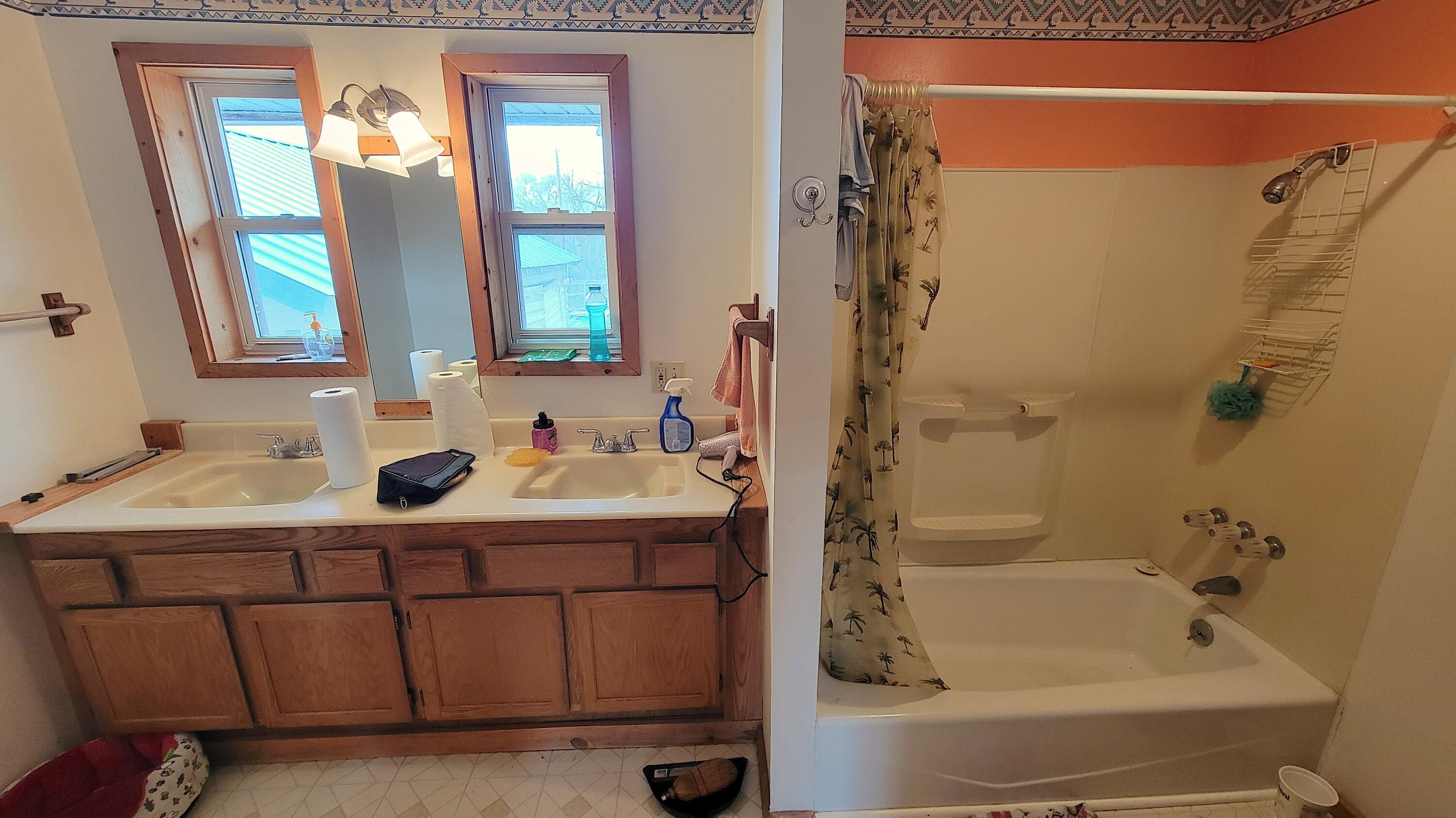 298 Main Street Monument, OR 97864 - Photo 27 of 66 a bathroom with a tub sink and mirror
