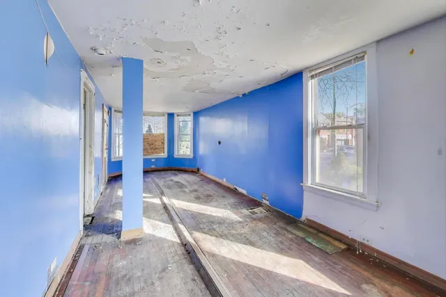 a view of hallway with windows