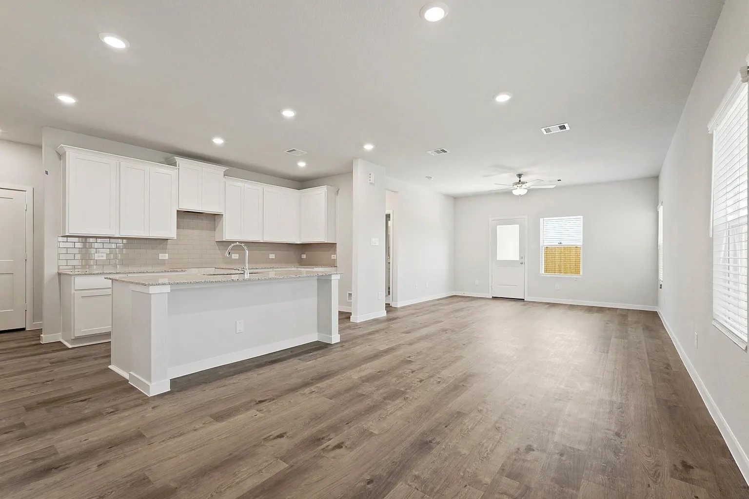 a view of kitchen with wooden floor
