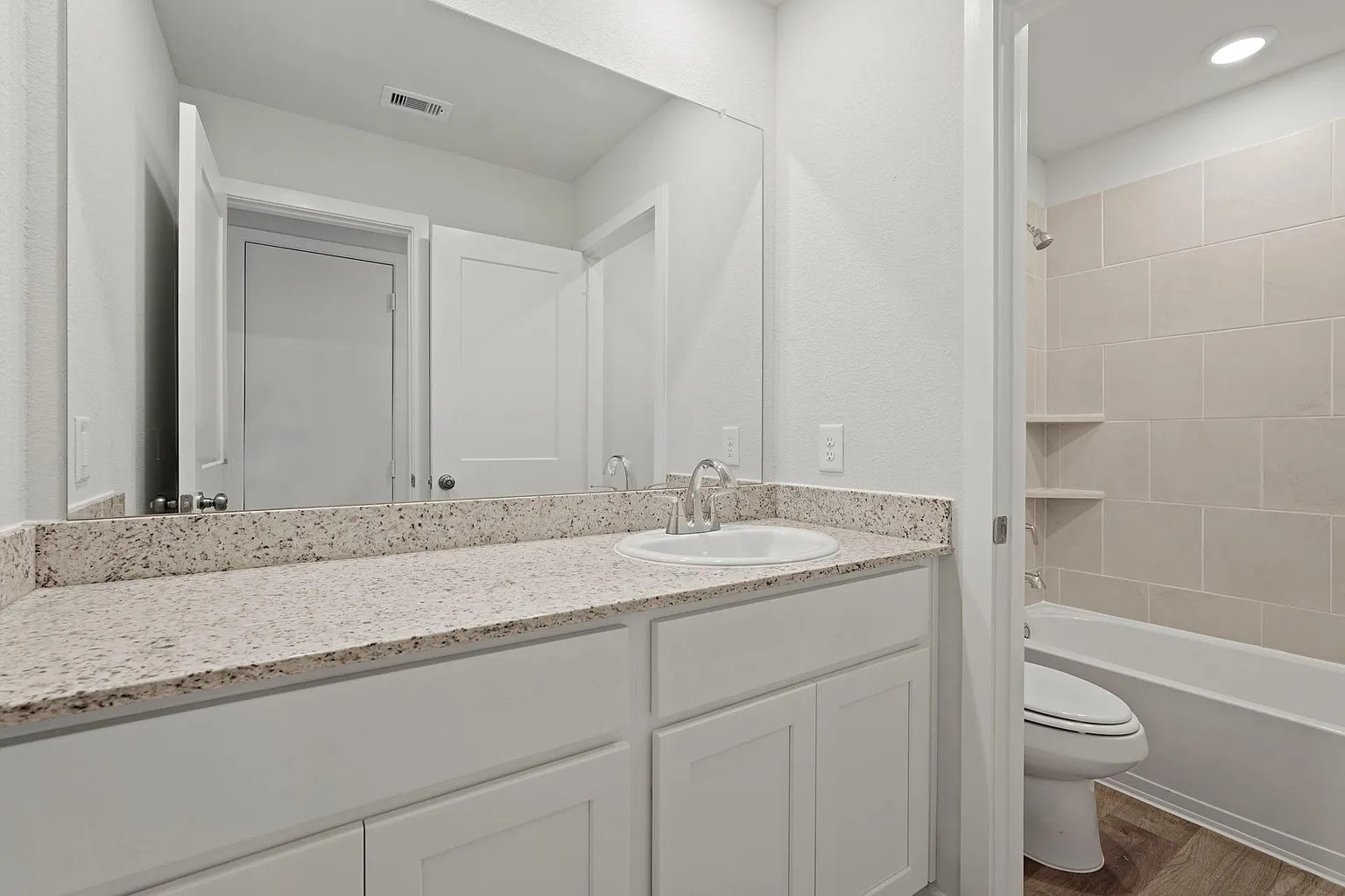 3927 Accolade Crossing Brookshire, TX 77423 - Photo 13 of 21 a bathroom with a granite countertop sink toilet and shower