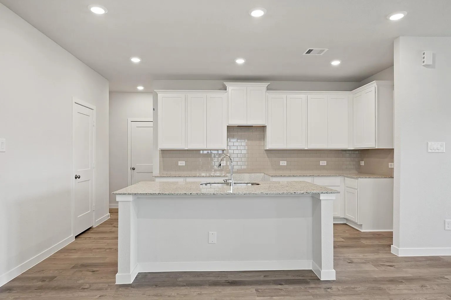 3927 Accolade Crossing Brookshire, TX 77423 - Photo 3 of 21 a kitchen with kitchen island stainless steel appliances a sink and cabinets