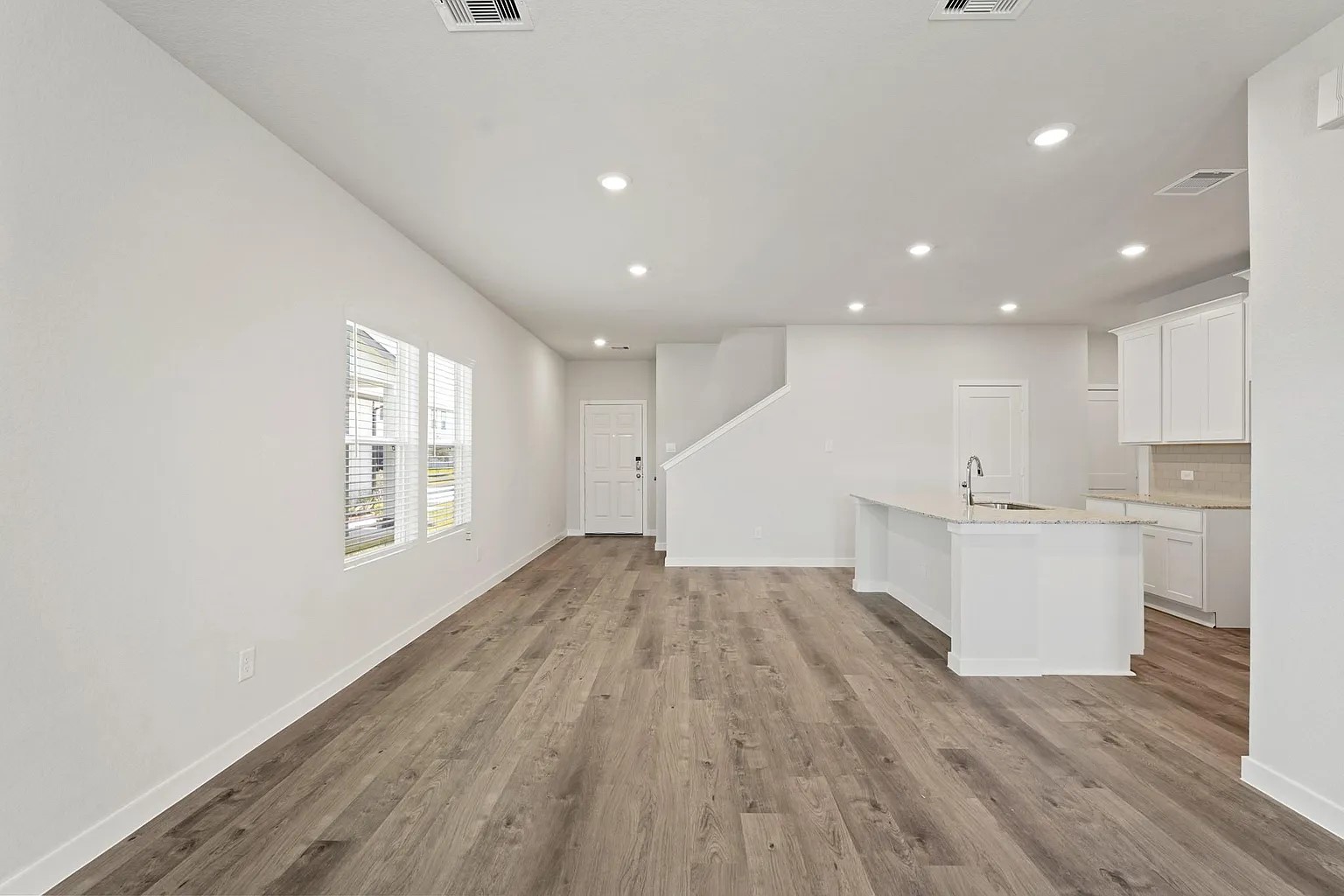 3927 Accolade Crossing Brookshire, TX 77423 - Photo 5 of 21 a view of an empty room with wooden floor and a window