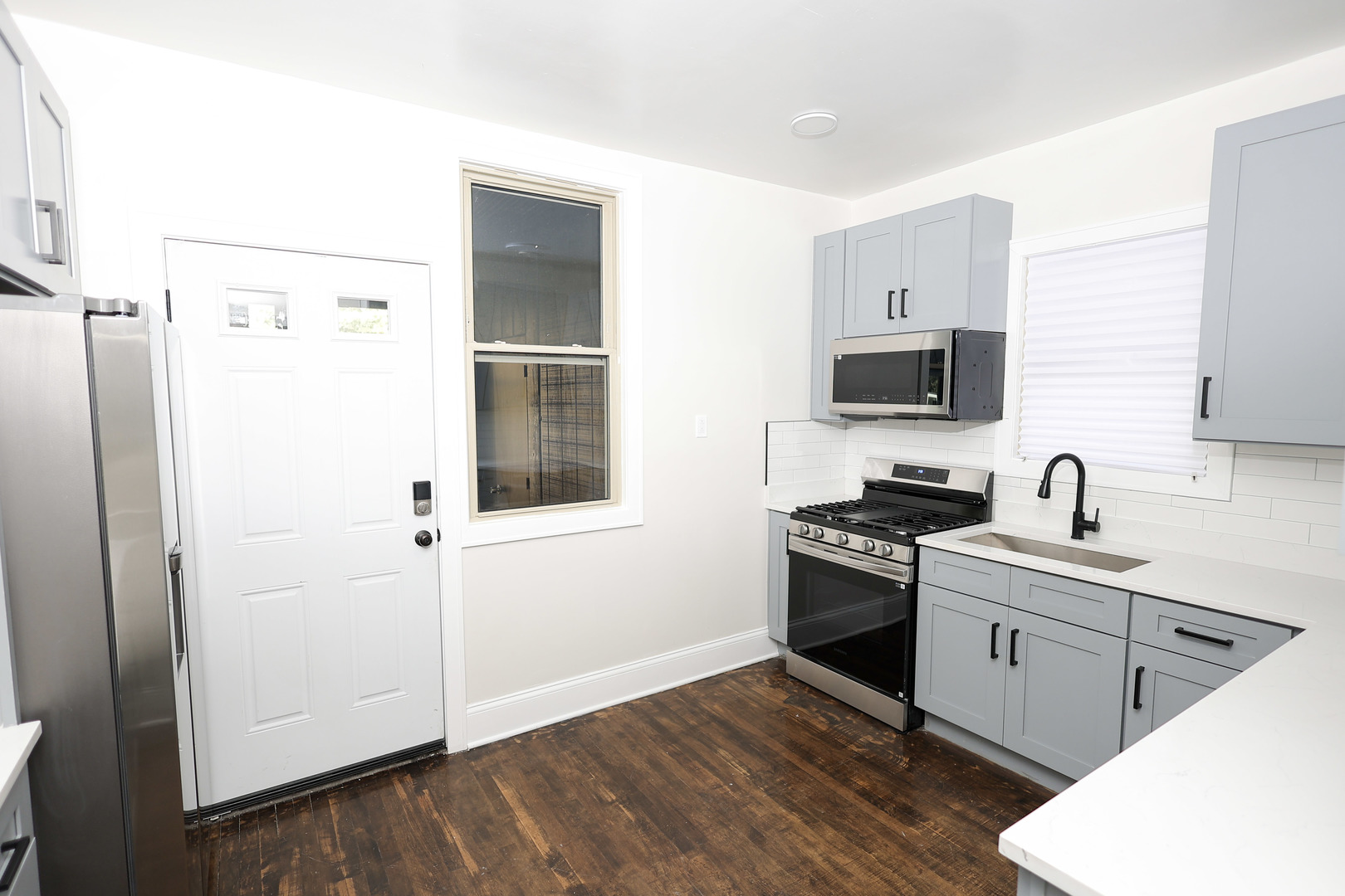 1724 West 105th Street Chicago, IL 60643 - Photo 11 of 34 a kitchen with a sink appliances and cabinets