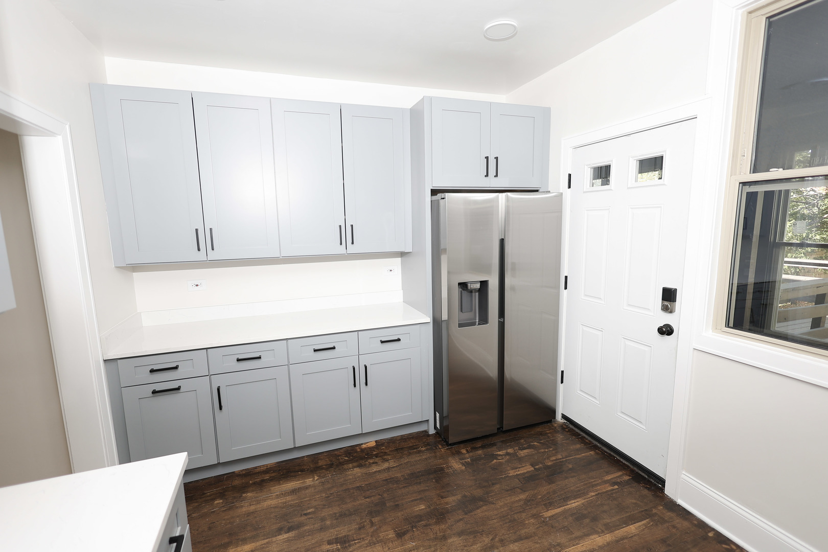 1724 West 105th Street Chicago, IL 60643 - Photo 12 of 34 a kitchen with stainless steel appliances a refrigerator and cabinets