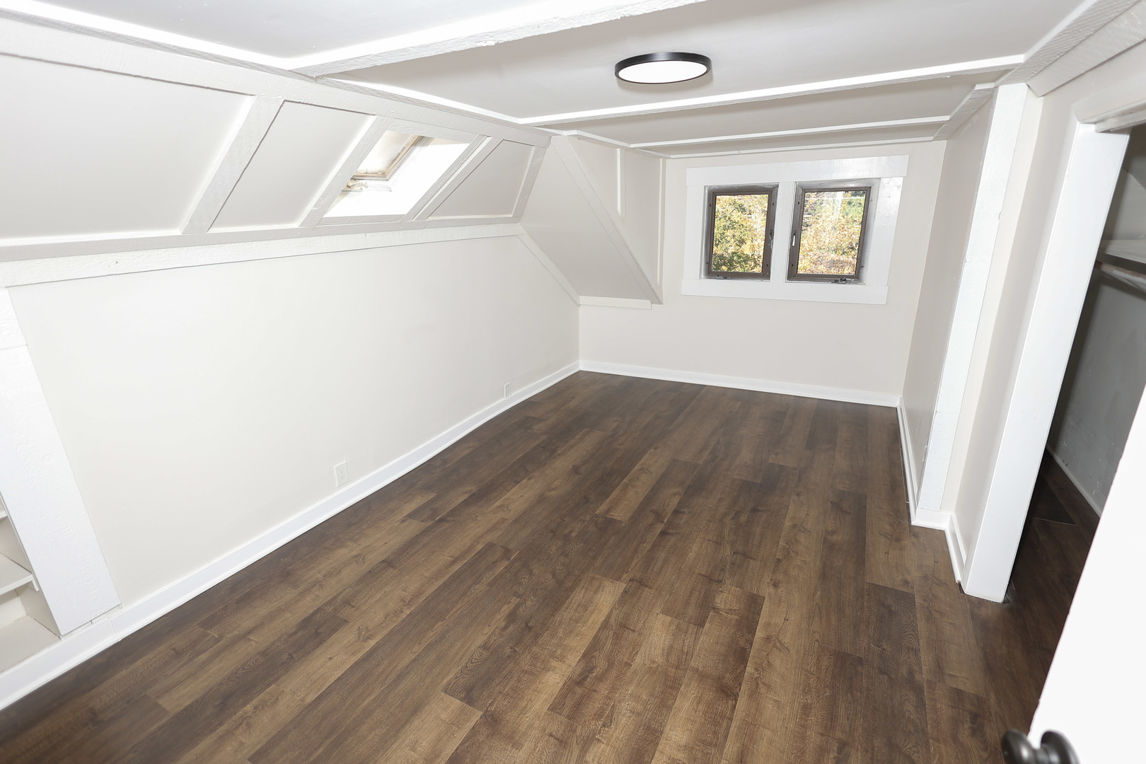 1724 West 105th Street Chicago, IL 60643 - Photo 15 of 34 a view of an empty room with wooden floor and a window