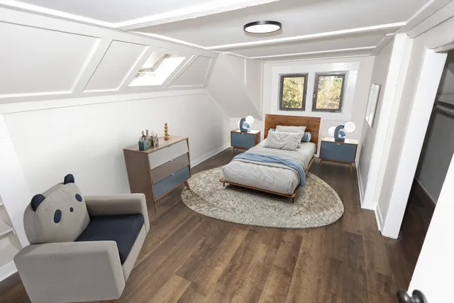 a bedroom with furniture and wooden floor