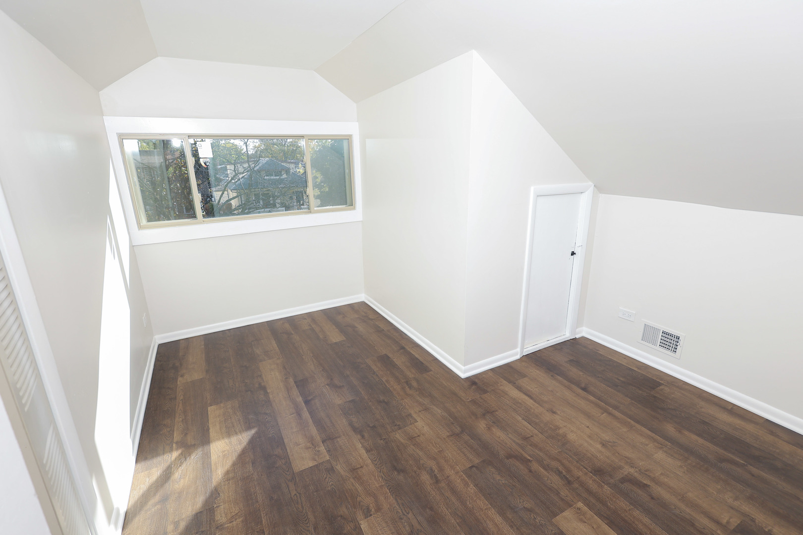 1724 West 105th Street Chicago, IL 60643 - Photo 23 of 34 an empty room with wooden floor and windows