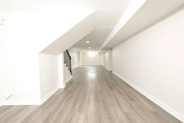 a view of gallery with wooden floor