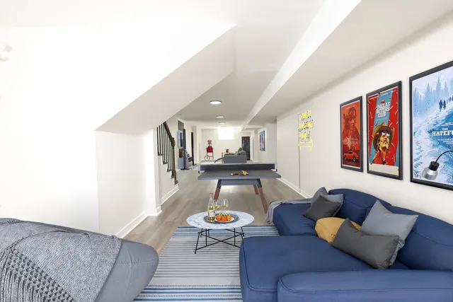 a living room with furniture and a rug